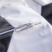 Close up of a paper clip in the safety zipper
