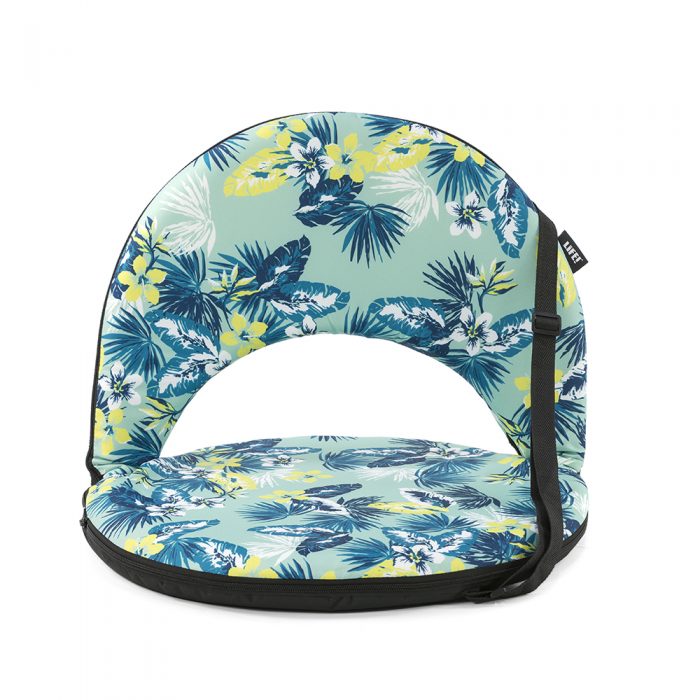 The tropical leaf print cushion recliner chair for beach, picnics or camping. The black trim and carry handle are visible.