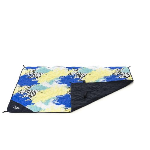 Tier print adventure mat, beach blanket, picnic rug with the corner rolled over to show the contrast underside and closing clasp
