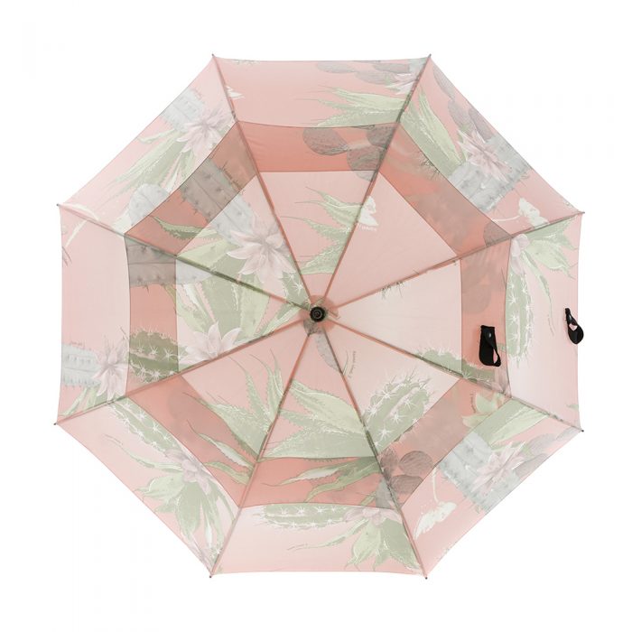 The Kakteen rain umbrella open from the top. The soft green and pink cactus print is large scale across the large canopy.