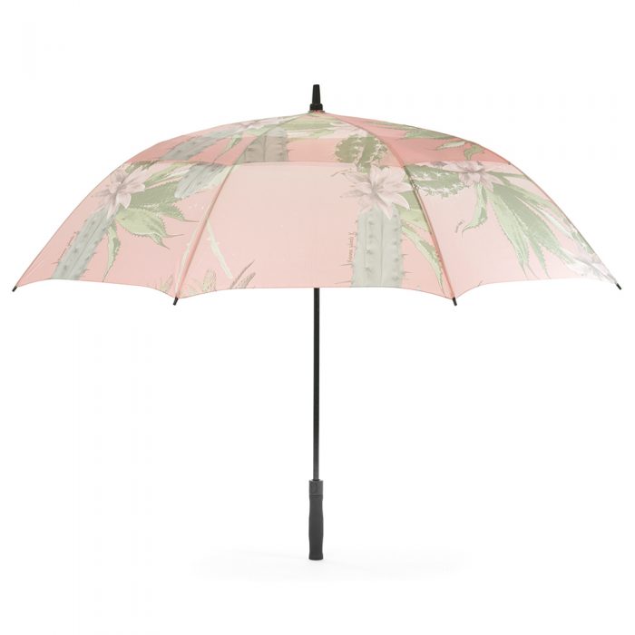 The kakteen print large rain golf umbrella shown open from the side. The print is a soft green and pink with cactus and cactus flowers.