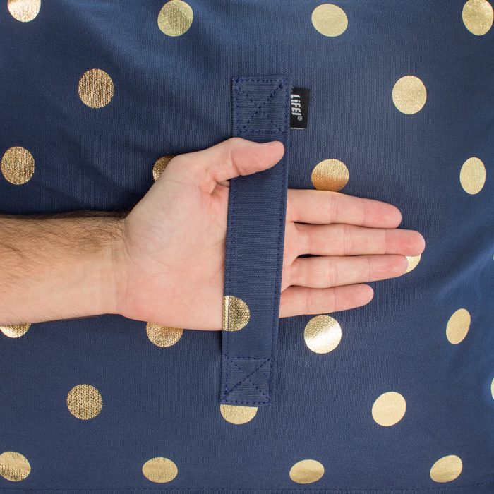 Close up of the handle on the navy blue metallic gold coin dot print