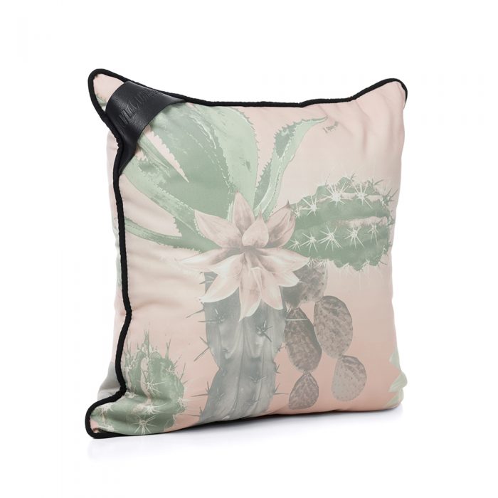 Oblique view of the hand drawn designer kakteen print indoor outdoor cushion featuring large scale cactus in a pale soft green and pink color