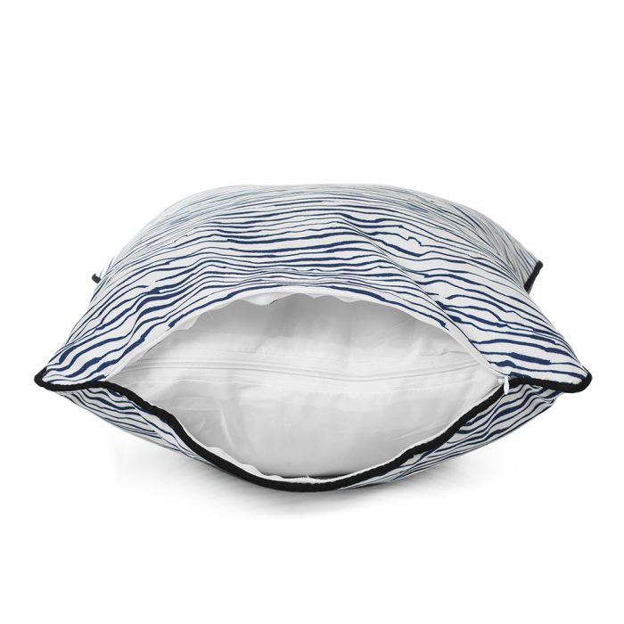 Side view of the blue wave print marine indoor outdoor cushion showing the cover and liner zippers and the black trim