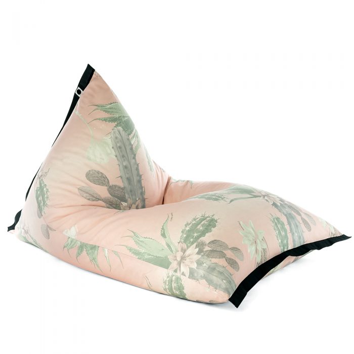 Lifestyle tetrahedral shaped bean bag in pink and green cactus print Kakteen material with black contrast trim