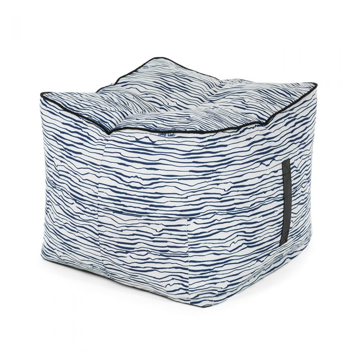 Oblique view of the blue wave print marine ottoman showing the carry handle and storage pocket.