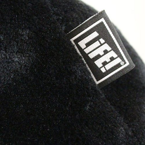 Close up of the black faux fur table and life! log tag on the iCrib