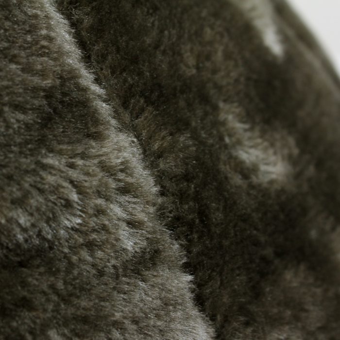 A close up of the donkey brown faux fur fabric used on the iCrib