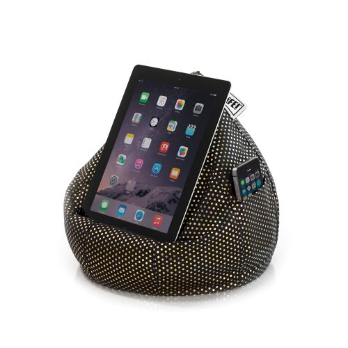 An iPad tablet smart device rests on a black iCrib book rest with small metallic gold dot print