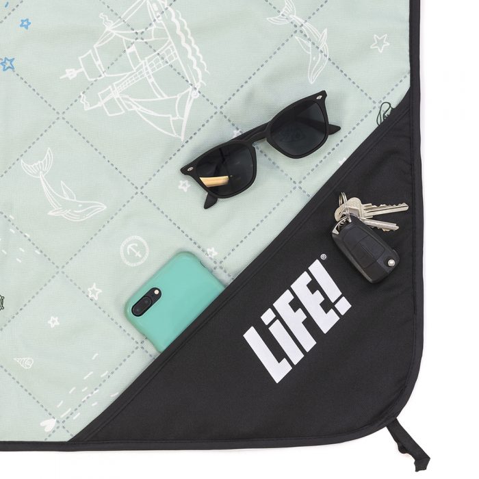 Close up of the privacy storage pocket on the sea of love adventure mat picnic rug