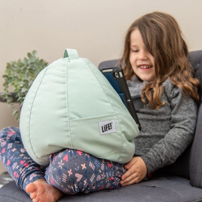 Tropical green iCrib bean bag in a child's lap holding an iPad